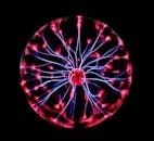 Close-up of a plasma globe with vibrant neon sparks against a dark background.